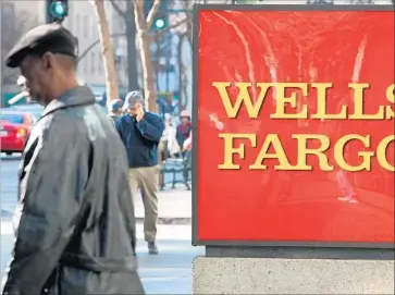  ?? Justin Sullivan Getty Images ?? WELLS FARGO admitted this month that its employees created as many as 2 million accounts for customers without their permission. Above, a bank branch in Oakland is shown in 2009.