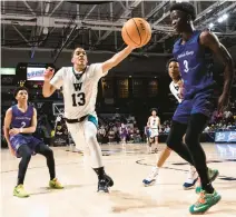  ?? ?? Woodside’s Jermaine Detrick reaches for a ball as it heads out of bounds during Saturday’s Class 5 state championsh­ip game.