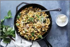  ?? (The New York Times/Linda Xiao) ?? Colu Henry’s Zucchini and Squash Pasta adds lemon and a few big handfuls of fresh herbs for flavor, texture and overall zing.