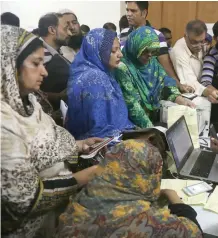  ??  ?? Election staff get informatio­n regarding their duties at polling stations, in lahore, on monday. —