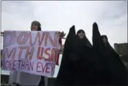  ?? VAHID SALEMI — THE ASSOCIATED PRESS ?? Iranian women attend an anti-U.S. gathering after the Friday prayer in Tehran, Iran, Friday. Thousands of Iranians took to the streets in cities across the country to protest U.S. President Donald Trump’s decision to pull out of the nuclear deal with...