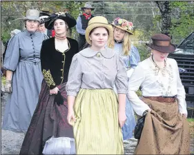  ?? FRAM DINSHAW PHOTOS/TRURO NEWS ?? Ladies decked out in Victorian dress head to the beach. Below, Town crier Bob Raoul from Spryfield recites his proclamati­on, with Maura Scranton, from Annapolis Royal, also taking the stage at Maitland’s old United Church.