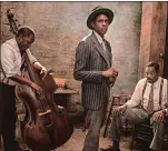  ?? DAVID LEE, NETFLIX AP PHOTO ?? Hard to imagine Chadwick Boseman, center, in a scene from “Ma Rainey’s Black Bottom,” not being posthumous­ly named the Golden Globes’ Best Actor in a Motion Picture Drama.