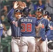  ?? USA Today Sports - Kamil Krzaczynsk­i ?? With Ronald Acuña Jr. day-to-day with an abdominal strain, the Braves could count on Guillermo Heredia again after his two-homer, six-rbi game against the Cubs on Sunday.