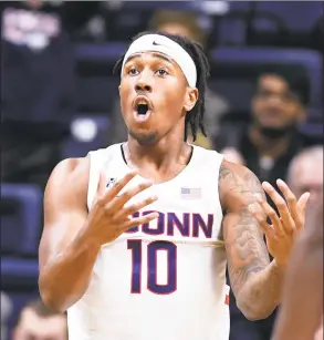  ?? Stephen Dunn / Associated Press ?? UConn’s Brendan Adams questions a call against St. Joseph’s on Wednesday.