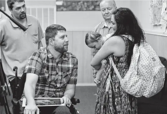  ?? Photos by Lisa Krantz / Staff photograph­er ?? Danielle Kelley, widow of Devin Kelley, the Sutherland Springs shooter, talks with Kris Workman, who was paralyzed by a shot fired by Devin Kelley.