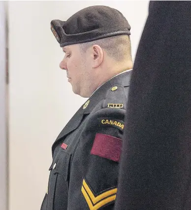  ?? ANDREW VAUGHAN / THE CANADIAN PRESS ?? Cpl. Garett Rollman arrives at a military court in Kentville, N.S., on July 31. Rollman, who was accused of using an inappropri­ate term for a black co-worker’s hair and of later striking a supervisor, has been found not guilty.