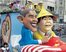  ?? Roberto Pfeil, dapd via AP ?? Effigies of former U.S. President Barack Obama and Chinese Prime Minister Hu Jintao are on a float during the Carnival Rose Monday Parade in Cologne, Germany, on Feb. 15.