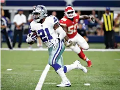  ?? AP Photo/ Michael Ainsworth ?? ■ Dallas Cowboys running back Ezekiel Elliott (21) carries the ball as Kansas City Chiefs linebacker Justin Houston (50) gives chase Nov. 5, 2017, in Arlington, Texas. Elliott’s success depends on an offensive line that’s the best in the business when healthy.