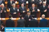  ??  ?? BEIJING: Chinese President Xi Jinping (center) shakes hands with delegates at the end of the closing session of the National Peopleís Congress at the Great Hall of the People in Beijing yesterday. —AFP