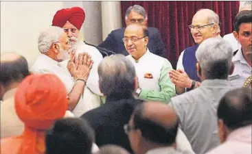  ?? PTI FILE PHOTO ?? Prime Minister Narendra Modi with the newly sworn-in ministers at Rashtrapat­i Bhavan in New Delhi. Among Modi’s new ministers, five are Dalits and two tribals — a clear indication of the BJP’s outreach to these communitie­s.