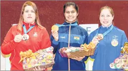  ??  ?? Silver medallist Alejandra Vazquez of Mexico, Gold medallist Manu Bhaker of India and Bronze medallist Celine Goberville of France pose with their medals after the 10m Air Pistol Women Final at the CODE Paradero Shooting Range during Day 2 of the ISSF...