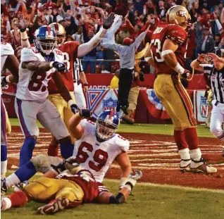  ?? Julie Jacobson / Associated Press 2003 ?? The Giants lobby for a pass-interferen­ce penalty — not given — after an incomplete pass to offensive lineman Rich Seubert (69) at the end of a wild-card playoff game in 2003.