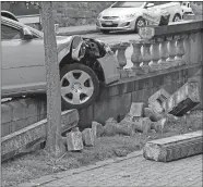  ?? SEAN D. ELLIOT/THE DAY ?? A car struck a stone balustrade Friday on Union Street by City Hall. There were no reported injuries in the crash.