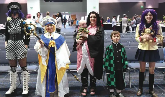  ?? ?? Costume contest winners, from left, second place Claire Dobbs, first place Angel Ojeras, honorable mentions Jacobi, Paige and Daniel Jackson, and third place Gracie Harris.