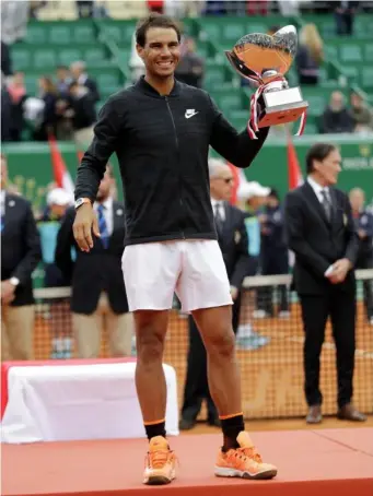  ??  ?? Nadal with his tenth Monte Carlo Masters trophy (Getty)