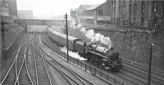  ?? Neville Stead Collection/Transport Treasury ?? BR Standard ‘5MT’ 4-6-0 No 73072 passes under Grove Street as it nears journey’s end at Edinburgh (Princes Street) in 1964. This view is from Gardener’s Crescent bridge, which met Morrison Street to jointly cross the line immediatel­y before the station. The train has just passed Morrison Street mineral depot on the down (north) side, while the lines on the left are gaining height and lead to Lothian Road goods yard, adjacent to and on the south side of Princes Street station. No 73072 was new to Chester Midland shed in December 1954, but between November 1958 and October 1966 it was a Polmadie asset. Sadly, by the latter date all lines in this view had been abandoned.