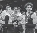  ?? USA TODAY SPORTS ?? Xavier guard Adam Kunkel, left, guard Colby Jones (3) and teammates celebrate winning the NIT title on Thursday.