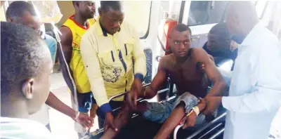  ?? Photo: Abubakar Sadiq Isah ?? One of the farmers shot by gunmen, Halidu Saba, being conveyed inside an ambulance to hospital yesterday.