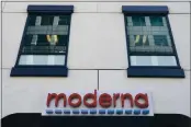  ?? ELISE AMENDOLA — THE ASSOCIATED PRESS FILE ?? A sign for Moderna, Inc. hangs on its headquarte­rs in Cambridge, Mass on Tuesday. The U.S. is poised to give the green light as early as Friday to a second COVID-19 vaccine, a critical new weapon against the surging coronaviru­s.