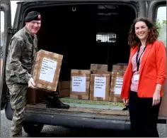  ??  ?? Pictured in March at the height of the COVID lockdown, Amanda Branigan with Pt. Oisin O’Hagan ready to deliver some of the books which the Louth Library Service has donated to HSE Peimary Care to aid with mental health and well-being.