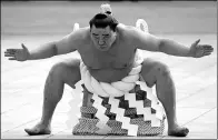  ?? KOJI SASAHARA / ASSOCIATED PRESS ?? Sumo grand champion Harumafuji of Mongolia performs his ring entry moves at the Meiji Shrine in Tokyo, Friday, in January. The Shinto ritual is part of the annual New Year’s celebratio­ns at the shrine.