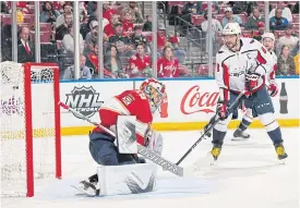  ??  ?? Capitals’ Alex Ovechkin, right, scores past Panthers goaltender Harri Sateri.