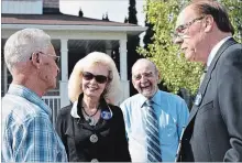  ?? JOELLE KOVACH/EXAMINER ?? Mayor Daryl Bennett and his wife Jewell speak with supporters on Thursday, following Bennett’s campaign announceme­nt regarding infrastruc­ture at the corner of Ravenwood Dr. and Parkhill Rd. W.