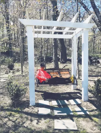  ??  ?? Georgann Frey relaxes at her Ridgefield home after walking 10 miles to Wilton Center on May 12.