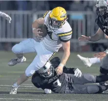  ?? CHRISTOPHE­R EVANS / BOSTON HERALD ?? RIVALS REUNITE: King Philip’s Ryan Halliday tries to gain some yardage during last night’s 10-7 victory against Mansfield in a rematch of Hockomock League foes for the Division 2 South championsh­ip.