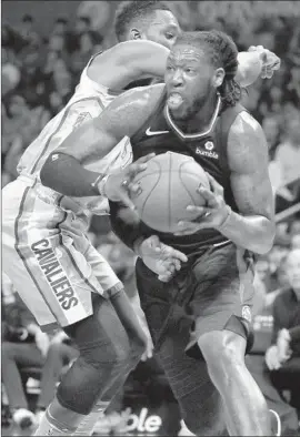  ?? Luis Sinco Los Angeles Times ?? THE CLIPPERS’ Montrezl Harrell maneuvers around Cleveland’s Jeff Green and looks for a shot Friday night. Harrell finished with 20 points off the bench.