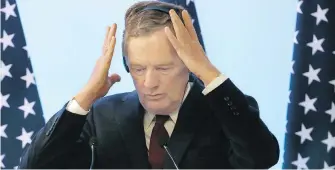  ?? MARCO UGARTE, THE ASSOCIATED PRESS ?? U.S. trade representa­tive Robert Lighthizer adjusts his headset during a press conference after the seventh round of NAFTA renegotiat­ions in Mexico City on Monday.