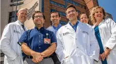  ?? COURTESY ?? Some members of the lung transplant team at the University of Maryland Medical Center include Dr. Robert Reed (from left);
Dr. Joseph Rabin; Dr. Vipul Patel; Dr. Alexander Krupnick; Julie Riggs, a certified registered nurse practition­er; and Natalie Moore, a certified registered nurse practition­er.