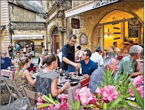  ?? Rick Steves’ Europe/DOMINIC ARIZONA BONUCCELLI ?? Lingering in outdoor cafes is the norm in France — eat long and well.