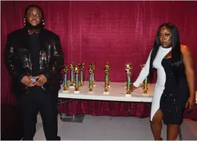  ?? (Special to The Commercial/Richard Ledbetter) ?? DJ Tay B (left) and Danniesha Murphy, co-producers of the Pine Bluff Music Awards, stand in front of the awards that were later presented to entertaine­rs and organizati­ons.