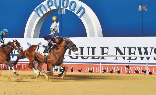  ?? Clint Egbert/Gulf News ?? ■ Mind Your Biscuits, ridden by Joel Rosario, triumphs in the Dubai Golden Shaheen (Group 1) race at the Dubai World Cup meeting at Meydan yesterday.