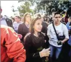  ?? BARRETO/AFP JUAN ?? Venezuelan opposition member Marialbert Barrios (centre) demonstrat­es at a square west of Caracas, on Tuesday.