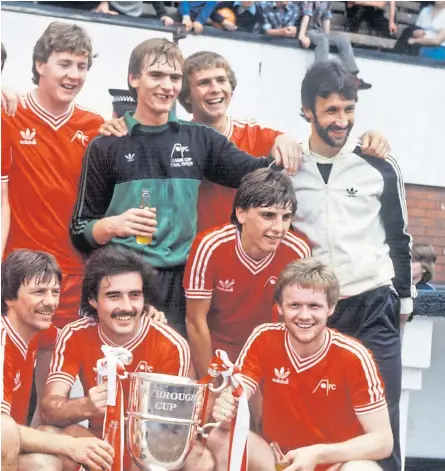  ??  ?? Above: Aberdeen players celebrate winning the Drybrough Cup in 1980 after beating St Mirren 2-1 at Hampden. Below: The Dons acknowledg­e their huge support at the 1993 European Cup Winners’ Cup, final. Bottom: Aberdeen manager Alex Ferguson presenting a trophy to Jim Leighton and, right, the keeper training with Scotland in 1996.