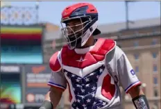  ?? Associated Press ?? Texas Rangers catcher Meibrys Viloria heads to the dugout Monday in Baltimore.