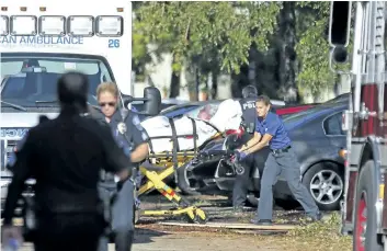  ?? AMY BETH BENNETT/AP ?? A woman is transporte­d from The Rehabilita­tion Center at Hollywood Hills on Wednesday as patients are evacuated after a loss of air conditioni­ng due to hurricane Irma in Hollywood, Fla. Several patients at the sweltering nursing home died in the...