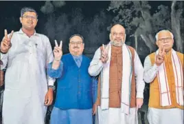  ?? PTI ?? (L-R) Jannayak Janta Party leader Dushyant Chautala, BJP’s working president JP Nadda, Union home minister Amit Shah and Haryana CM Manohar Lal Khattar in New Delhi on Friday.