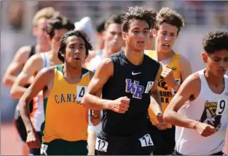  ?? Katharine Lotze/Special
to The Signal (See additional photos on signalscv.com) ?? Canyon’s Ethan Danforth, left, and West Ranch’s Isaiah Seidman, right, run the 3200-meter run at the CIF-Southern Section Masters meet at El Camino College in Torrance on Saturday.