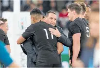  ?? Photo / Mark Mitchell ?? The Springboks (left) celebrate their win over England; (right) Steve Hansen hugs Richie Mo’unga after New Zealand beat Wales in the bronze playoff.
