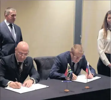  ?? PHOTO: SUPPLIED ?? Stavros Nicolaou, Aspen senior executive (left) and Professor Yury Khotimchen­k of the Far Eastern Federal University of Russia, sign a collaborat­ion agreement, while deputy president of the Russian Republic, Yury Trutnev, looks on.