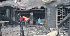  ?? ANI ?? NDRF personnel and other officials inspect the Covid care centre in Vijayawada on Sunday. n