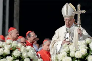  ?? PHOTO: ANDREW MEDICHINI/AP ?? Pope Francis arrives to celebrate an Easter Mass, in St Peter’s Square at the Vatican.