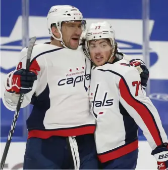  ?? AP ?? HOT START: T.J. Oshie, right, had three points to lead the Capitals to a 6-4 win over Buffalo in both teams’ season-opener.