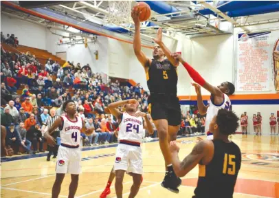  ?? | PAT GLEASON/ FOR THE SUN- TIMES ?? Simeon’s Talen Horton- Tucker scored 25 points against Curie in the Pontiac tournament final.