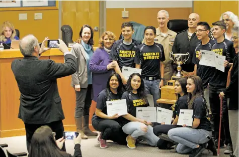  ?? LUIS SÁNCHEZ SATURNO/THE NEW MEXICAN ?? Santa Fe High School’s Navy JROTC program was honored Tuesday at the Santa Fe school board meeting for its first- and third-place wins in marksmansh­ip in a recent national competitio­n held in Phoenix.