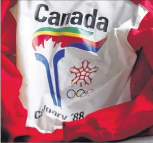  ?? CP PHOTO ?? A uniform from the 1988 Olympic torch run is seen in Calgary in this file photo from Thursday, Oct. 8, 2009. Calgary’s city administra­tion has raised concerns over how bidding for the 2026 Winter Olympics could affect municipal finances, but says the...